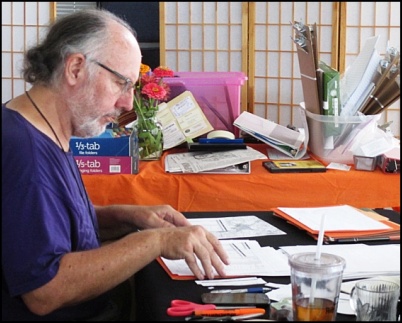 Volunteer Steve Lamb assembles precinct packets at Sunrise Center (10-15-2015). CWSM staff photo.