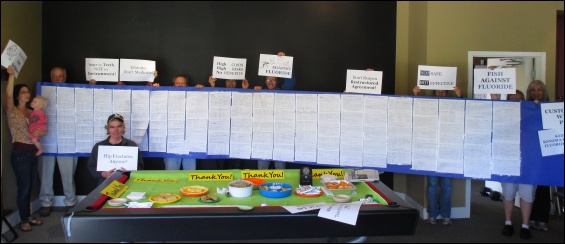 Clean Water Sonoma-Marin's giant scroll with signatures of thousands of Sonoma County residents against water fluoridation.